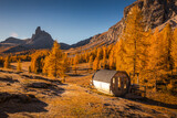 Fototapeta  - Fall sunrise on Lake Federa in the Italian Dolomites. Yellow larches create a unique atmosphere of this place.