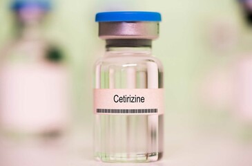 Wall Mural - Cetirizine. Cetirizine medical liquid for injection in a glass vial