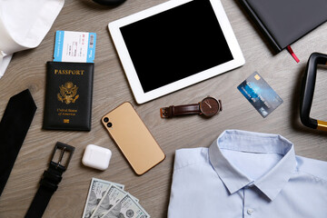 Sticker - Business trip stuff on wooden surface, flat lay