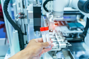 Wall Mural - hand with disposable test tube virus sampling,robot arm with test tube in laboratory