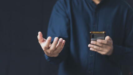 Wall Mural - Social media technology concept, men's hands using smartphones to login social media, work from home or do online marketing. business and finance