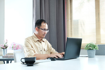 Poster - Man is utilizing a laptop computer. Using a smartphone, online live chat chatting on an application communication website and social network