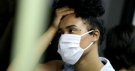 Wall Mural - Stressed out young black woman in subway during virus outbreak