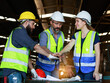 © atitaph - male and female engineers Talk to the worker, smile, show appreciation for Work successfully within industrial plants