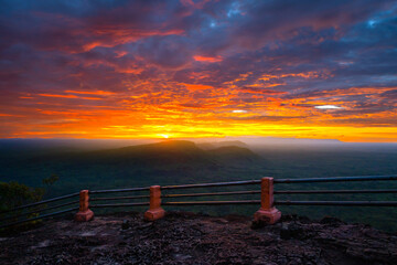 Wall Mural - vivid color sunset with amazing cloud over the mountain