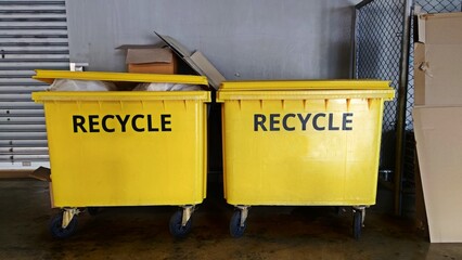 big two yellow recycling containers at the recycle center.