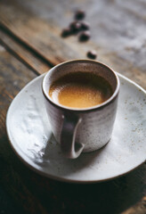 Wall Mural - Cup of espresso coffee on rustic wooden background. Copy space