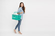 © comzeal - Beautiful Asian woman smiling and holding green grocery basket isolated on white background, Shopping and Supermarket concept, Full body composition