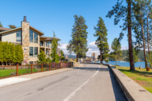 Luxury Waterfront Homes Face The Lake With The City Beach, Park And Downtown Resort And Marina In View In Coeur D'Alene, Idaho, USA.