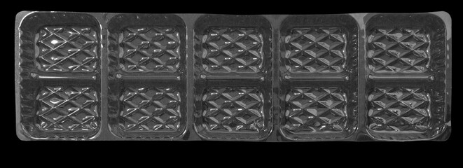 Wall Mural - Clear plastic shipping tray on black background.