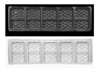Wall Mural - Clear plastic shipping trays and black and white backgrounds