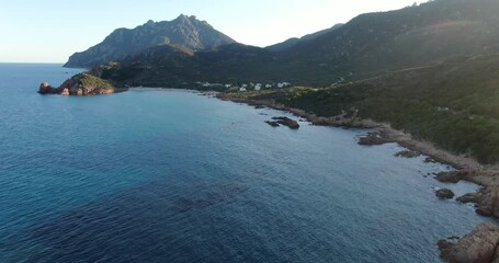 Wall Mural - Su Sirboni beach, Sardinia, Italy. Aerial drone view, ascending slow flight along the coastline.