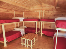 Interior Of A Log Cabin With Bunk Beds