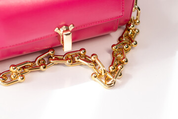 pink little handbag with gold chain isolated on white background. Product photography. bags and purses