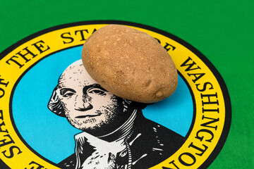 Wall Mural - Russet Potato with Washington state flag. Potato farming production, trade and exports concept.