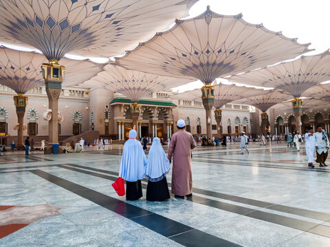 MEDINA, SAUDI ARABIA - April 27 2018 : family Muslim pilgrims visiting the beautiful Nabawi Mosque, the Prophet mosque which has an amazing architecture during umrah season.
