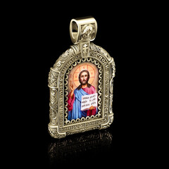 orthodox icon made of gold with the image of Christ on a black background