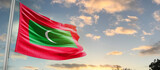 Fototapeta  - Maldives national flag cloth fabric waving on the sky - Image