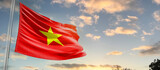 Fototapeta  - Vietnam national flag cloth fabric waving on the sky - Image
