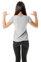 Wall Mural - Pretty young woman in stylish t-shirt on white background, back view