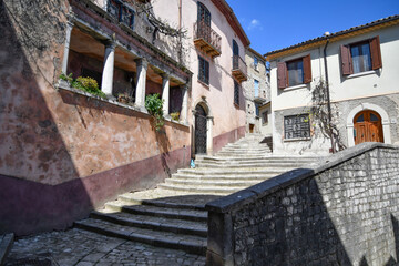 A narrow street between the old houses of Morcone, a village in the province of Benevento, Italy.