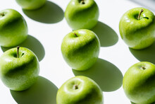 Close Up Of Green Tasty Apples On White.