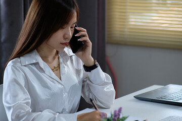 Sticker - Woman is utilizing a laptop computer. Using a smartphone, online live chat chatting on an application communication website and social network