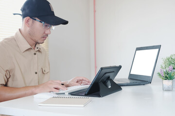 Poster - Man works by typing on a computer while texting on his cell phone. Online learning education for students Contact us at adult professional talking on laptop, cellphone Consider your company plan. 