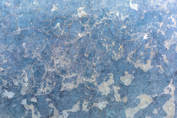 Polished blue marble surface with gray spots as a background, texture, pattern.