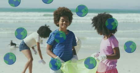 Sticker - Animation of globes over happy african american family picking waste on sunny beach