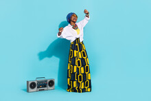 Photo Of Zulu Lady Enjoy Aborigine Song Sound Dance Boom Box Wear Tradition Outfit Isolated Teal Color Background