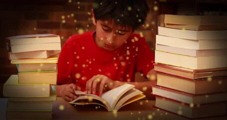 Sticker - Animation of glowing spots over asian boy reading book