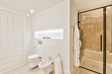 Modern Bathroom Interior With Shower Cabin Toilet Bowl And Bidet