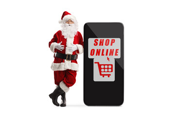 Sticker - Full length portrait of santa claus leaning on a smartphone with text shop online