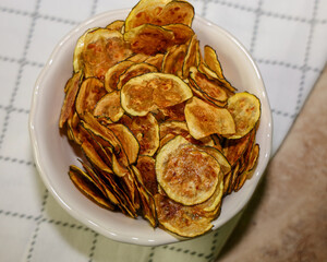 Ketogenic zucchini chips in a bowl. Chips for keto diet.