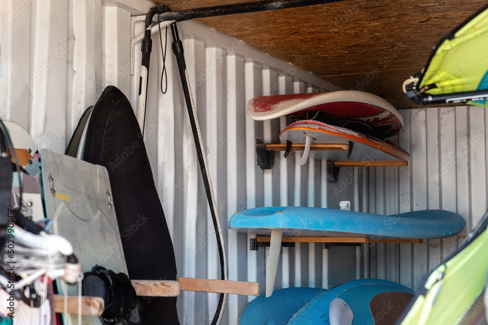 Windsurf Base Rack Interior of windsurf boards storage room in old rusty metal shipping ...