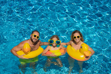 Wall Mural - Happy family in outdoor pool