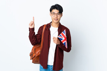 Poster - Chinese man holding an UK flag isolated on purple background pointing up a great idea