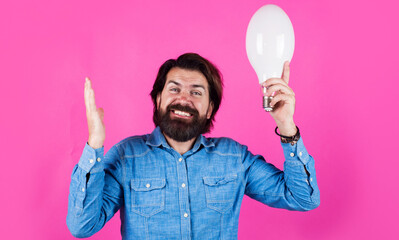 Happy bearded man with light bulb. I have idea. Birth of ideas. Male with lamp.