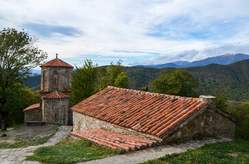 Wall Mural - Stone church with tiled roof of the Nekresi Orthodox monastery in Alazani valley, Georgia