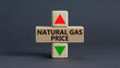 © Dzmitry - Symbol for increasing or decreasing price for natural gas. A cube symbolizing Natural gas price level. Beautiful grey background. Business and natural gas price concept. Copy space.