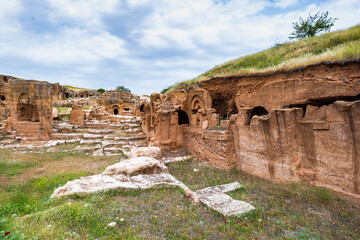 Wall Mural - Dara ancient site and the rock tombs near the city of Mardin, Turkey. The view of archaeological site of Dara, Mesopotamia, Turkey