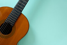 Old Classic Guitar On Green Table Background, Music Concept