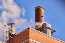 Industrial Chimney Releasing Fumes, Steam And Polluting Gases