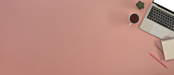 Poster - Top view of a pink-peach desk with a laptop keyboard, a cup of coffee, a cactus and other office supplies in the copy space. Flat lay composition.