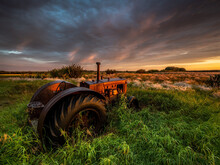 Closeup Shot Of A Tractor In An Abandoned Farm Near Kinley, Saskatchewan, Canada