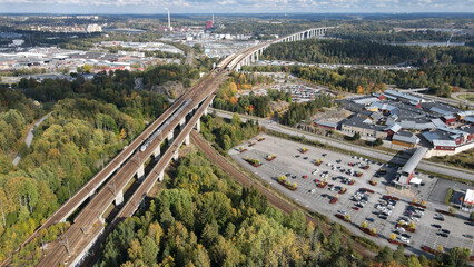 Canvas Print - Aerial shot of a highway road in the woods