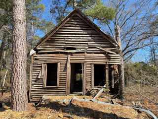 Poster - Old crumbling wooden dilapidated building front view