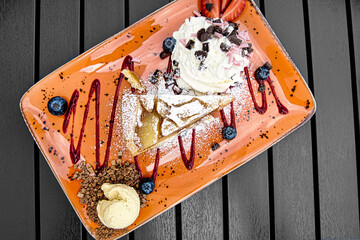 Wall Mural - Top view shot of desert on plate with cream and chocolate