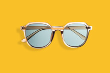 Gold Sunglasses On Yellow Background, Concept Of Summer, Vacation